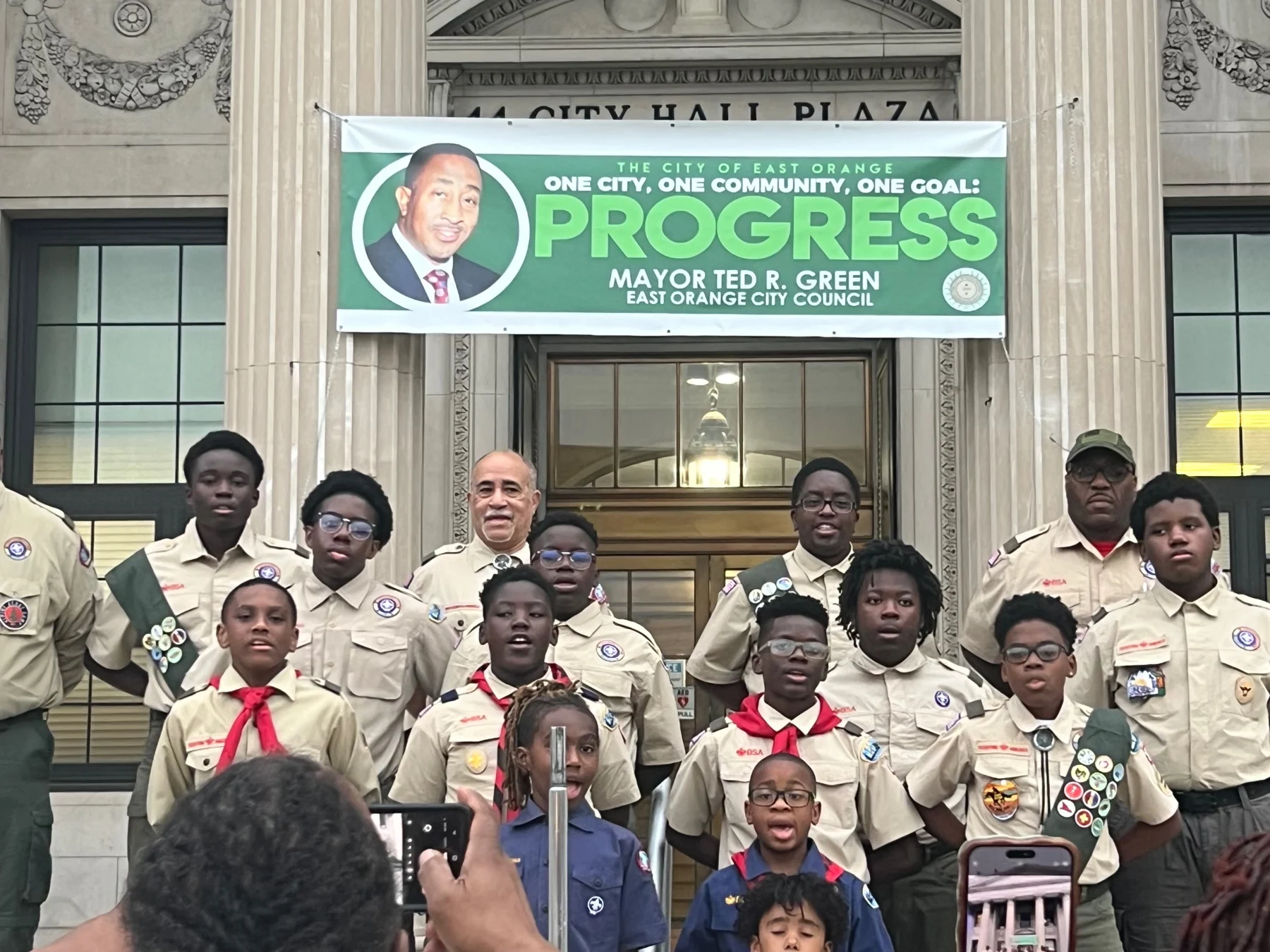 Troop members and adult leaders gathered outside City Hall
